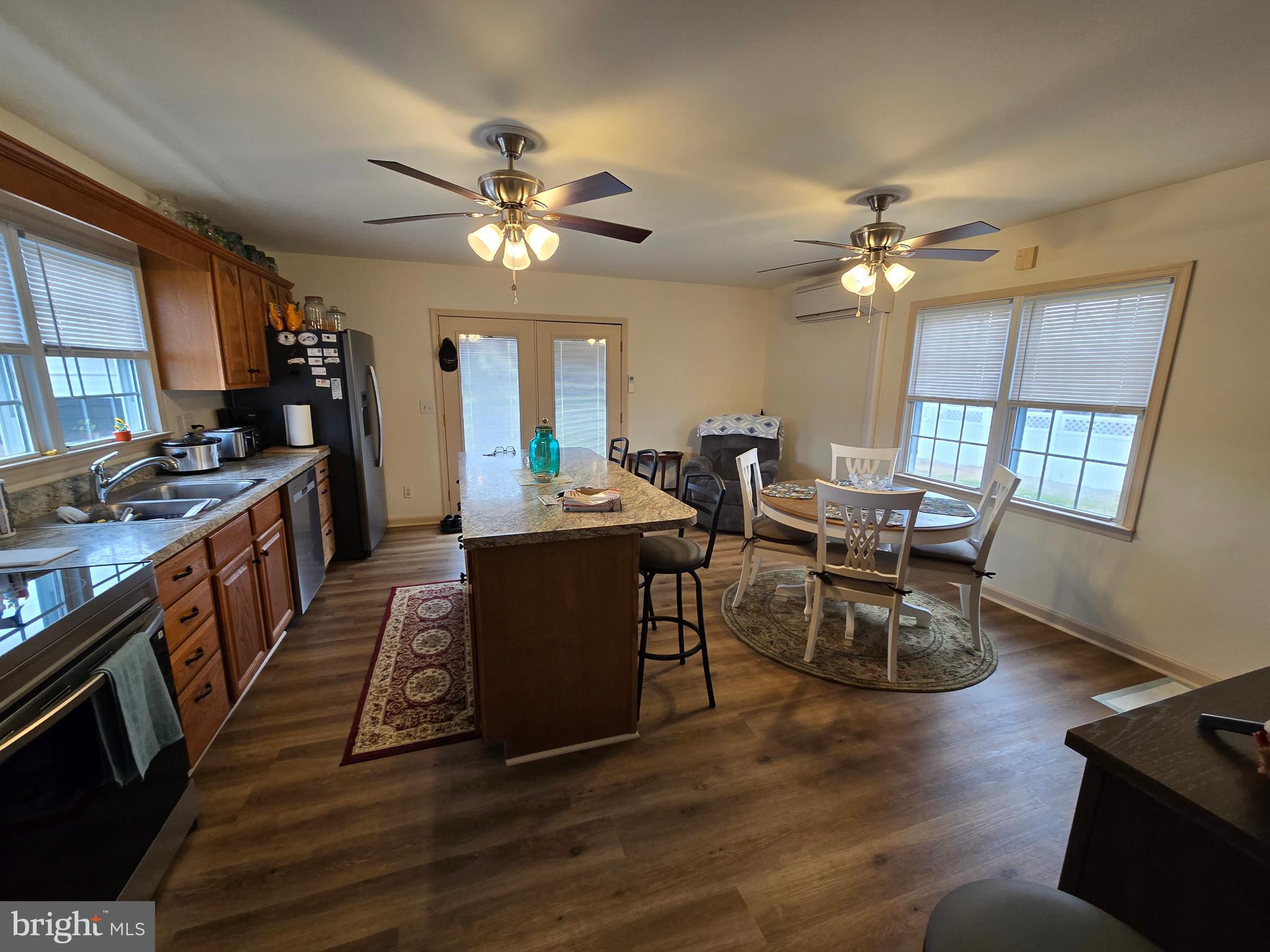 205 Myrtle Street Crisfield, MD 21817 - Photo 10 of 56 a view of a dining room with furniture window and wooden floor