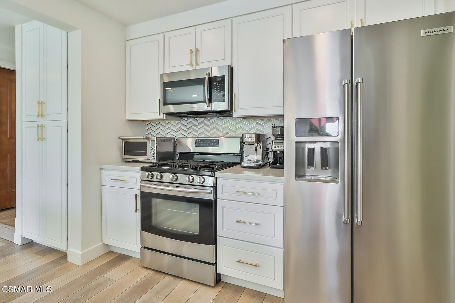 252 Rancho Road Thousand Oaks, CA 91362 - Photo 24 of 56 a kitchen with stainless steel appliances white cabinets and a refrigerator