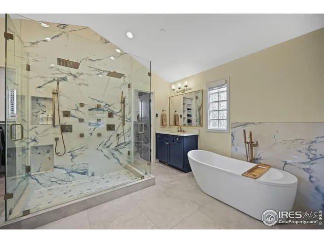 a living room with a couch and a chandelier