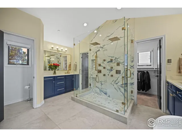 a living room with stainless steel appliances kitchen island granite countertop furniture and a fireplace