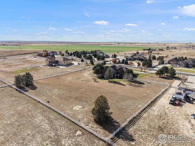 a view of a yard in front of the house with a yard