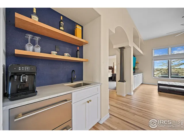 a view of cabinets with wooden floor and furniture