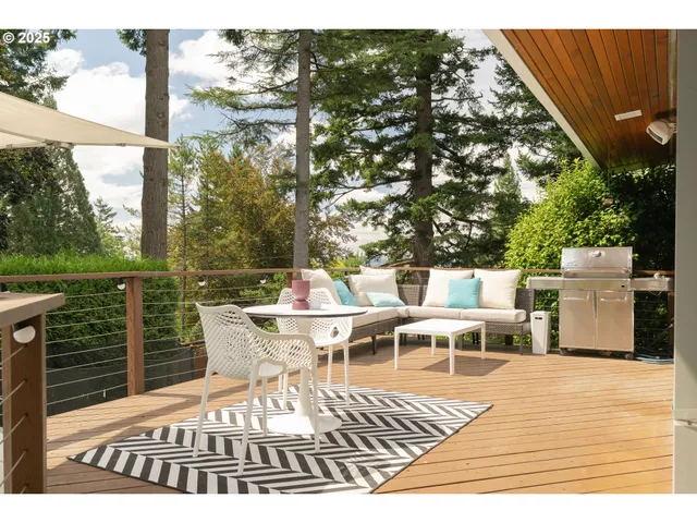 a view of a lake with couches chairs