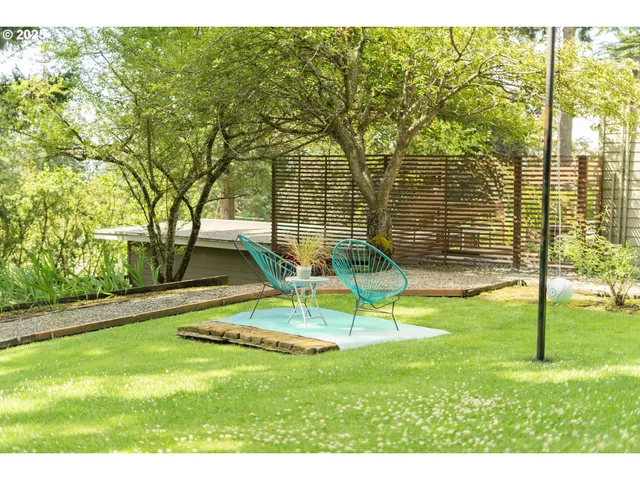 a backyard of a house with lots of green space