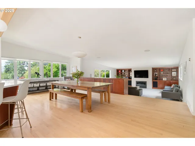 a living room with furniture a rug and a large window