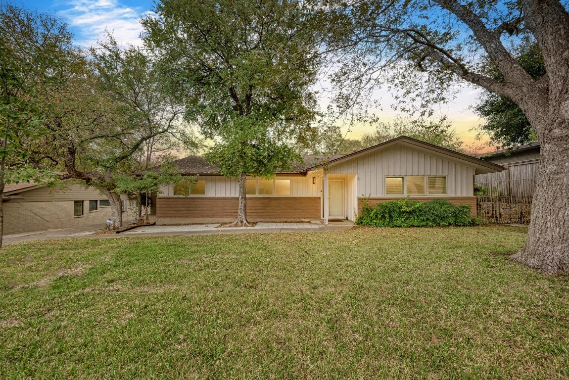 front view of a house with a yard