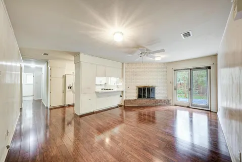 a view of a kitchen with a stove cabinets and wooden floor