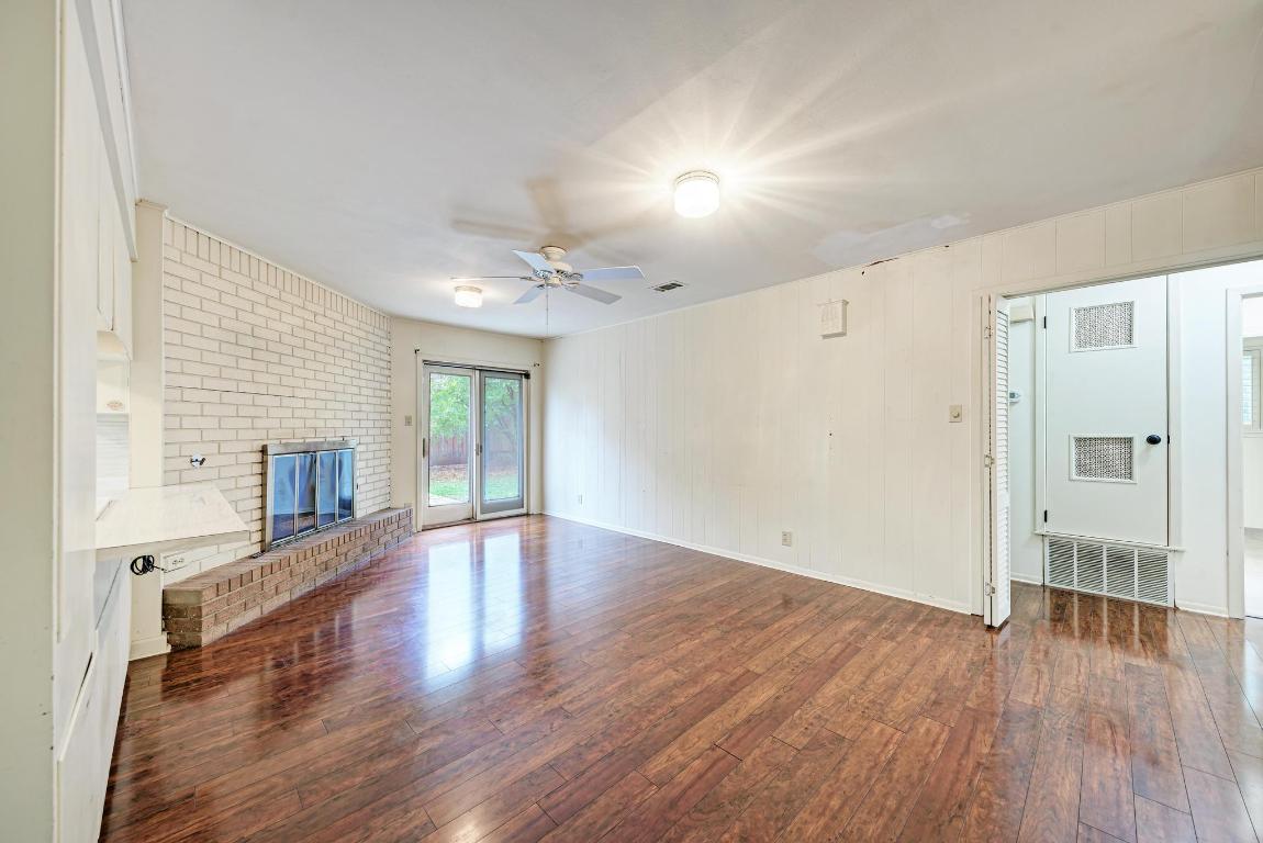 2500 Spring Creek Drive Austin, TX 78704 - Photo 15 of 40 an empty room with wooden floor and windows