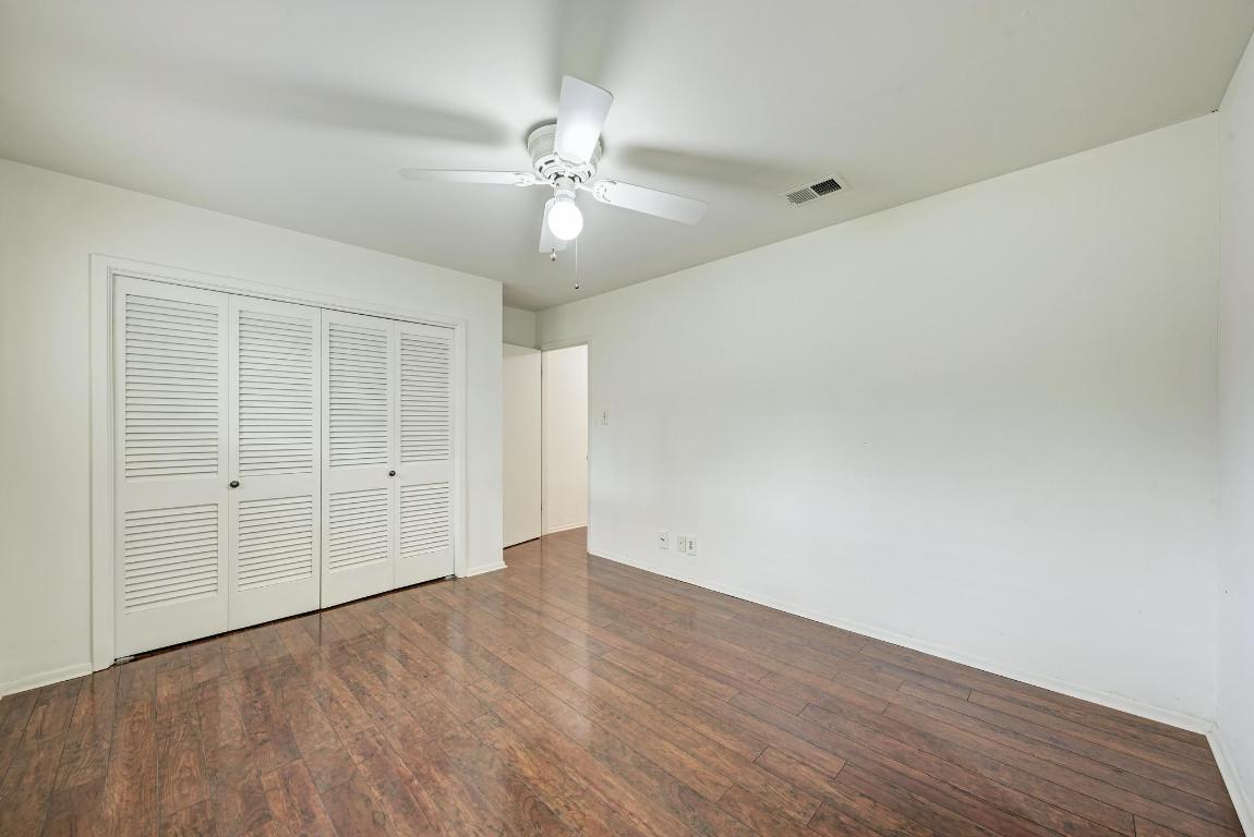 2500 Spring Creek Drive Austin, TX 78704 - Photo 26 of 40 a view of an empty room with wooden floor
