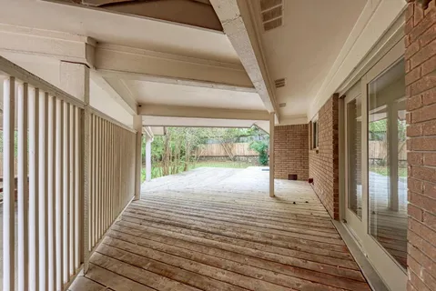 a bathroom with a large window and shower