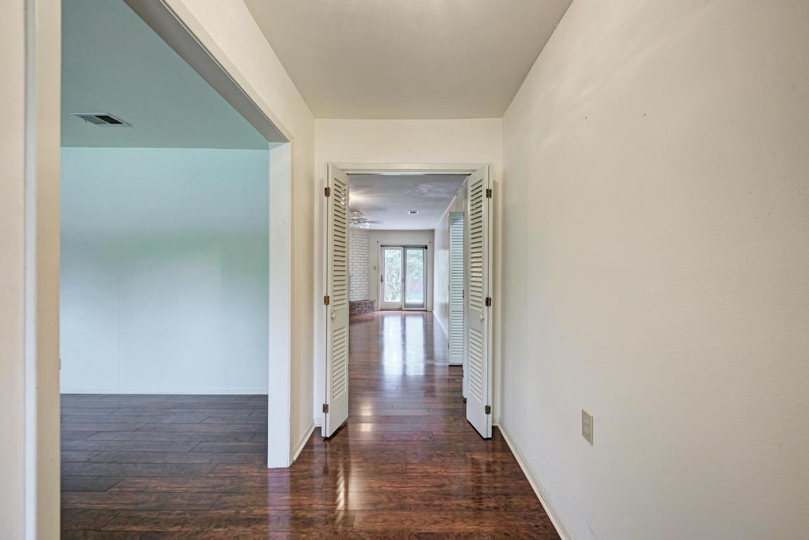2500 Spring Creek Drive Austin, TX 78704 - Photo 9 of 40 a view of a hallway with wooden floor