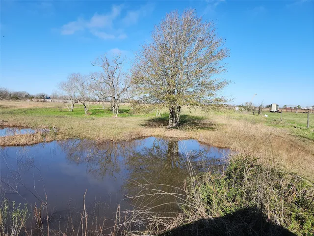 a view of lake with green space