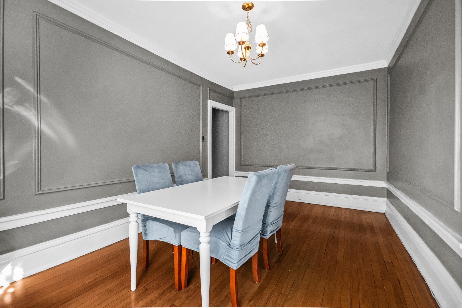 212 North Oak Park Avenue, Unit 2EE Oak Park, IL 60302 - Photo 6 of 15 a view of a dining room with furniture wooden floor and chandelier