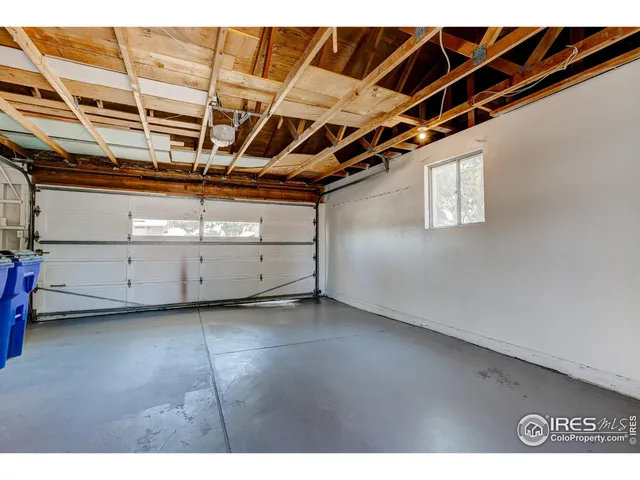 a view of a backyard with plants and a patio