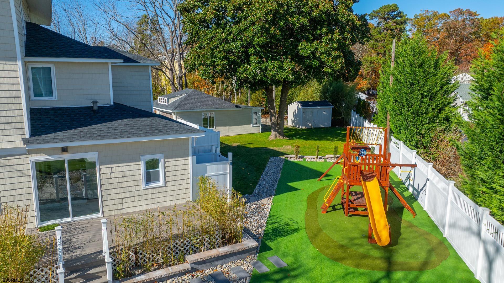 1203 West Mill Road Northfield, NJ 08225 - Photo 69 of 90 a view of a house with pool and chairs