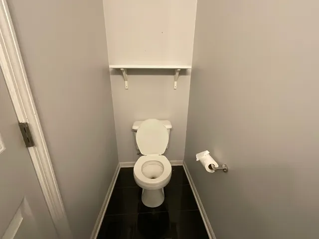 a bathroom with a toilet and a sink