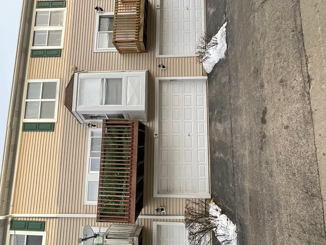 a front view of a house with a garage