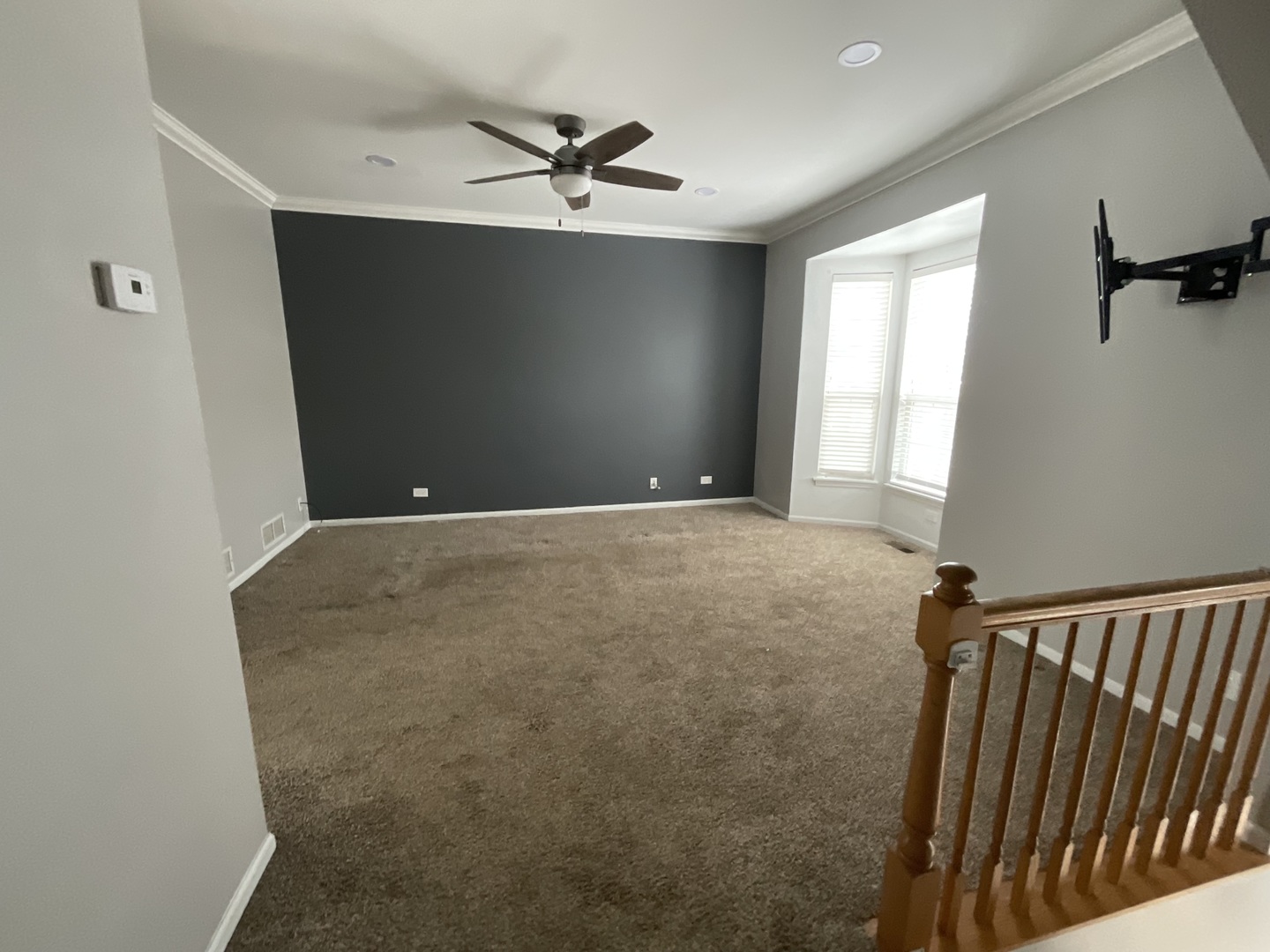 1116 Village Center Parkway, Unit 4 Aurora, IL 60506 - Photo 3 of 20 a view of a livingroom with a ceiling fan and window