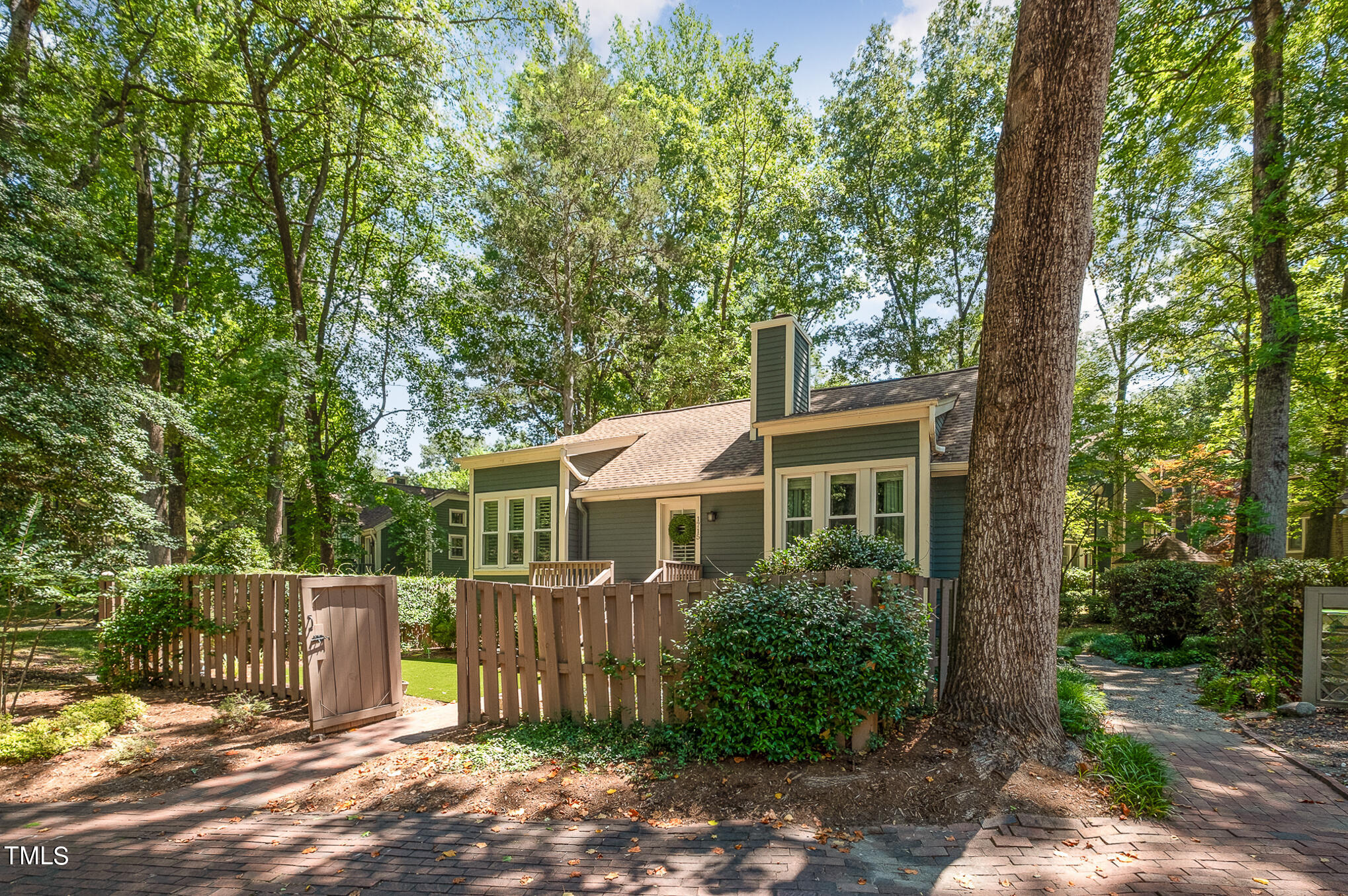 1715 Falls Church Road Raleigh, NC 27609 - Photo 1 of 19 a front view of a house with a yard