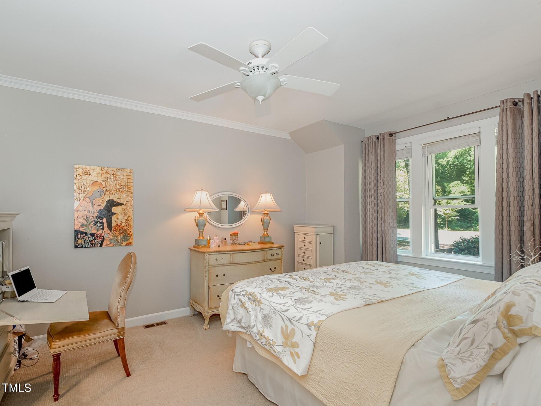 1715 Falls Church Road Raleigh, NC 27609 - Photo 14 of 19 a bedroom with a bed and a window
