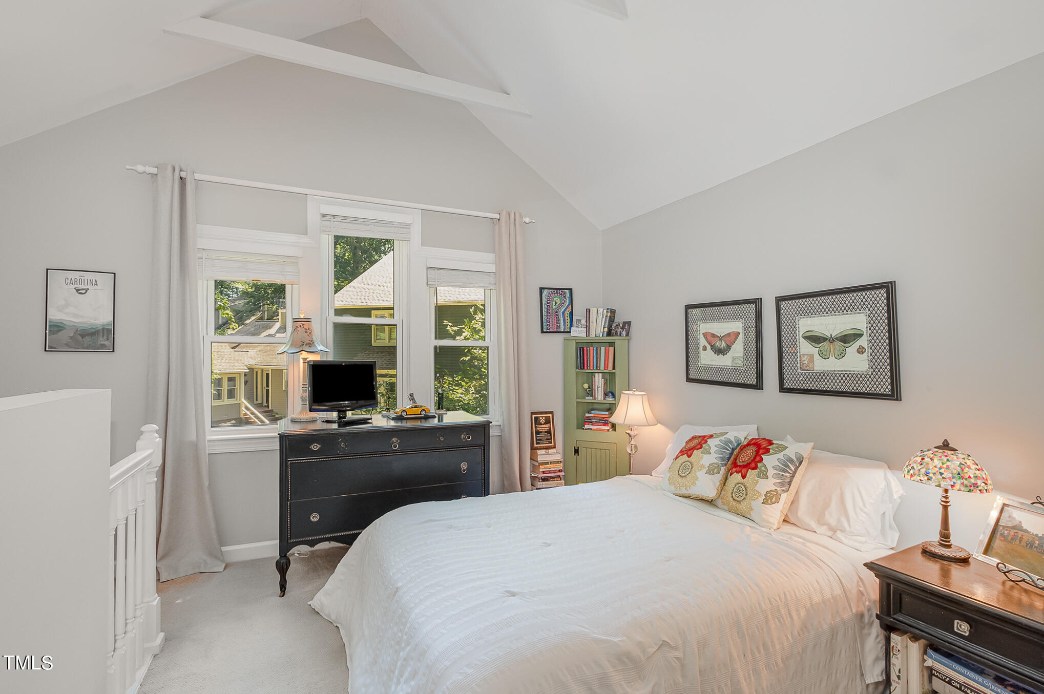 1715 Falls Church Road Raleigh, NC 27609 - Photo 16 of 19 a bedroom with a bed and a flat screen tv