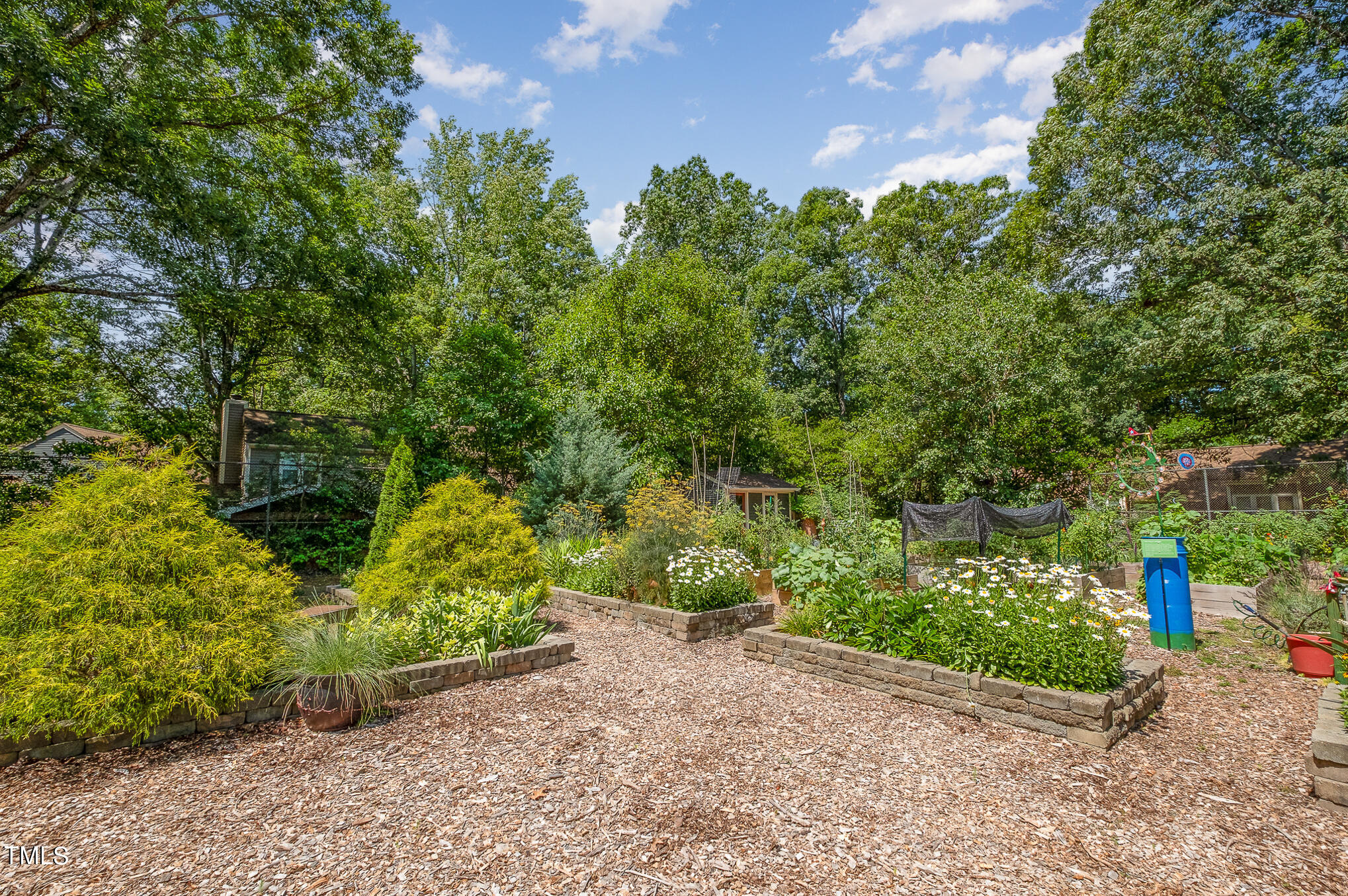 1715 Falls Church Road Raleigh, NC 27609 - Photo 19 of 19 a view of a street with potted plants and large trees