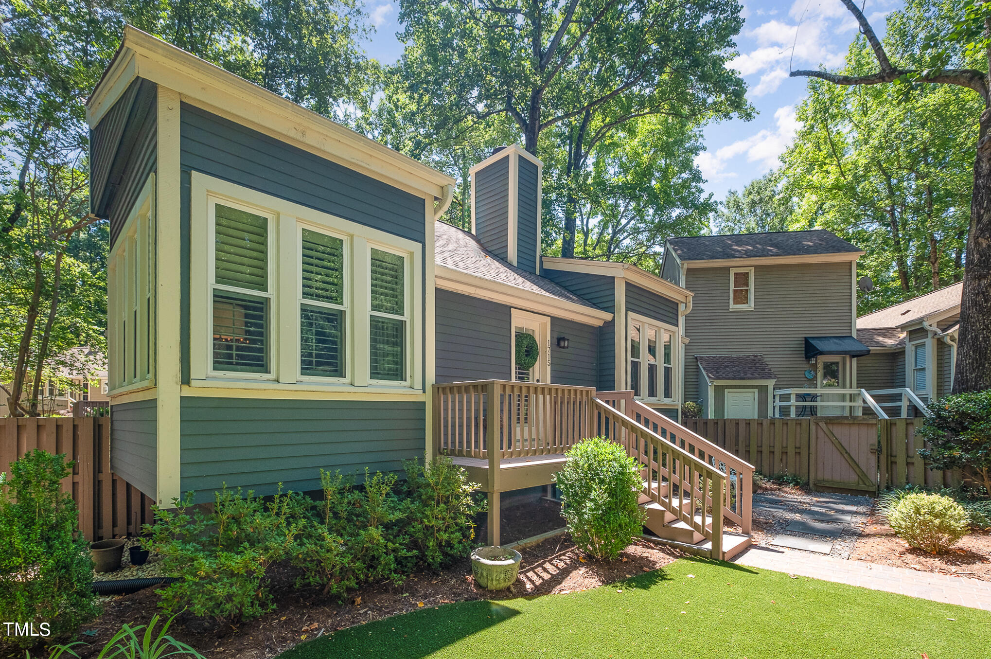 1715 Falls Church Road Raleigh, NC 27609 - Photo 2 of 19 a small garden is sitting in front of a house