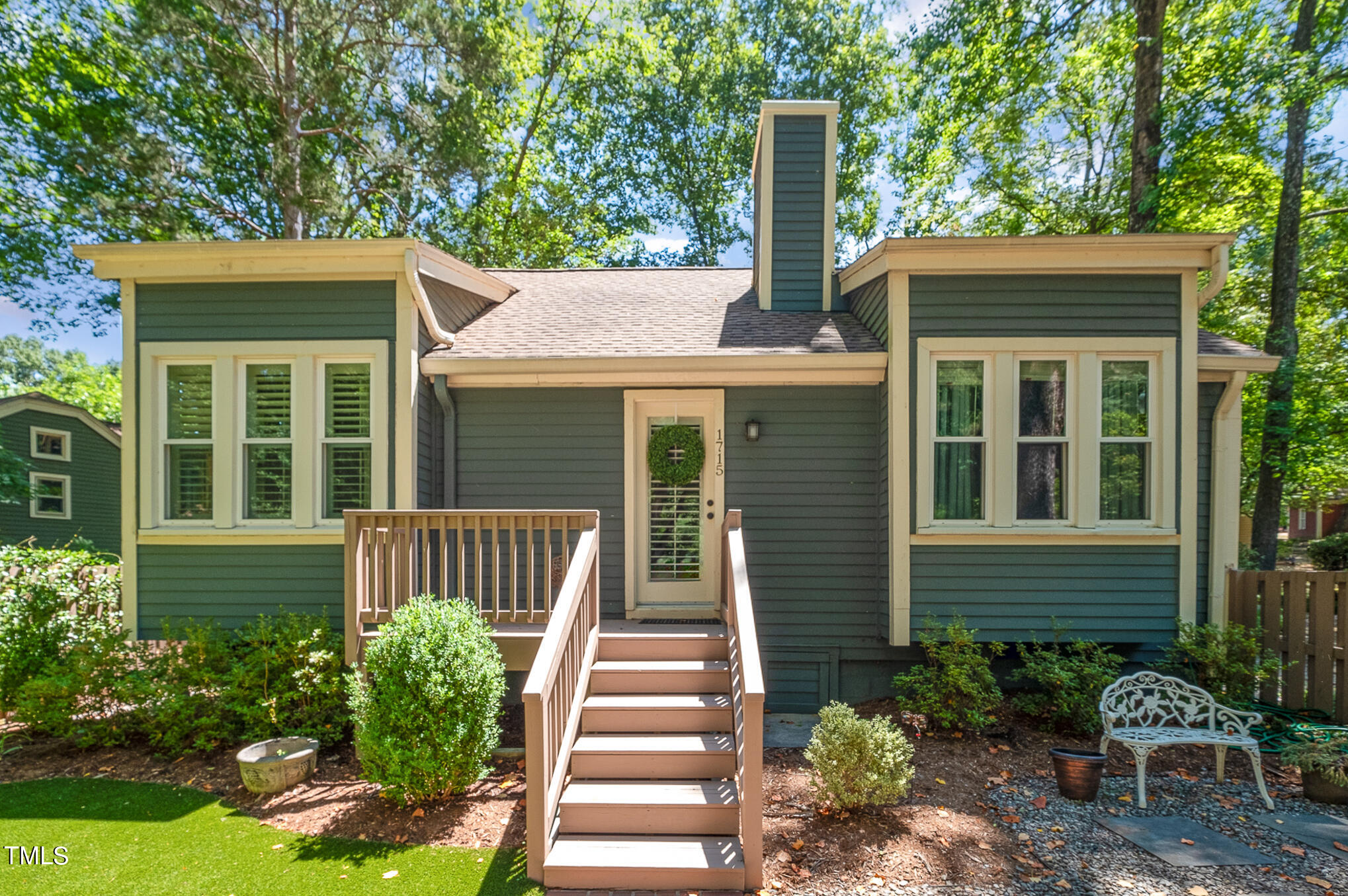 1715 Falls Church Road Raleigh, NC 27609 - Photo 4 of 19 a front view of a house with garden