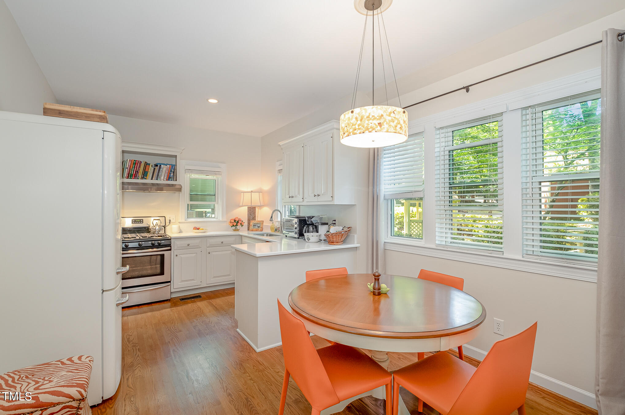 1715 Falls Church Road Raleigh, NC 27609 - Photo 10 of 19 a kitchen with a dining table and chairs