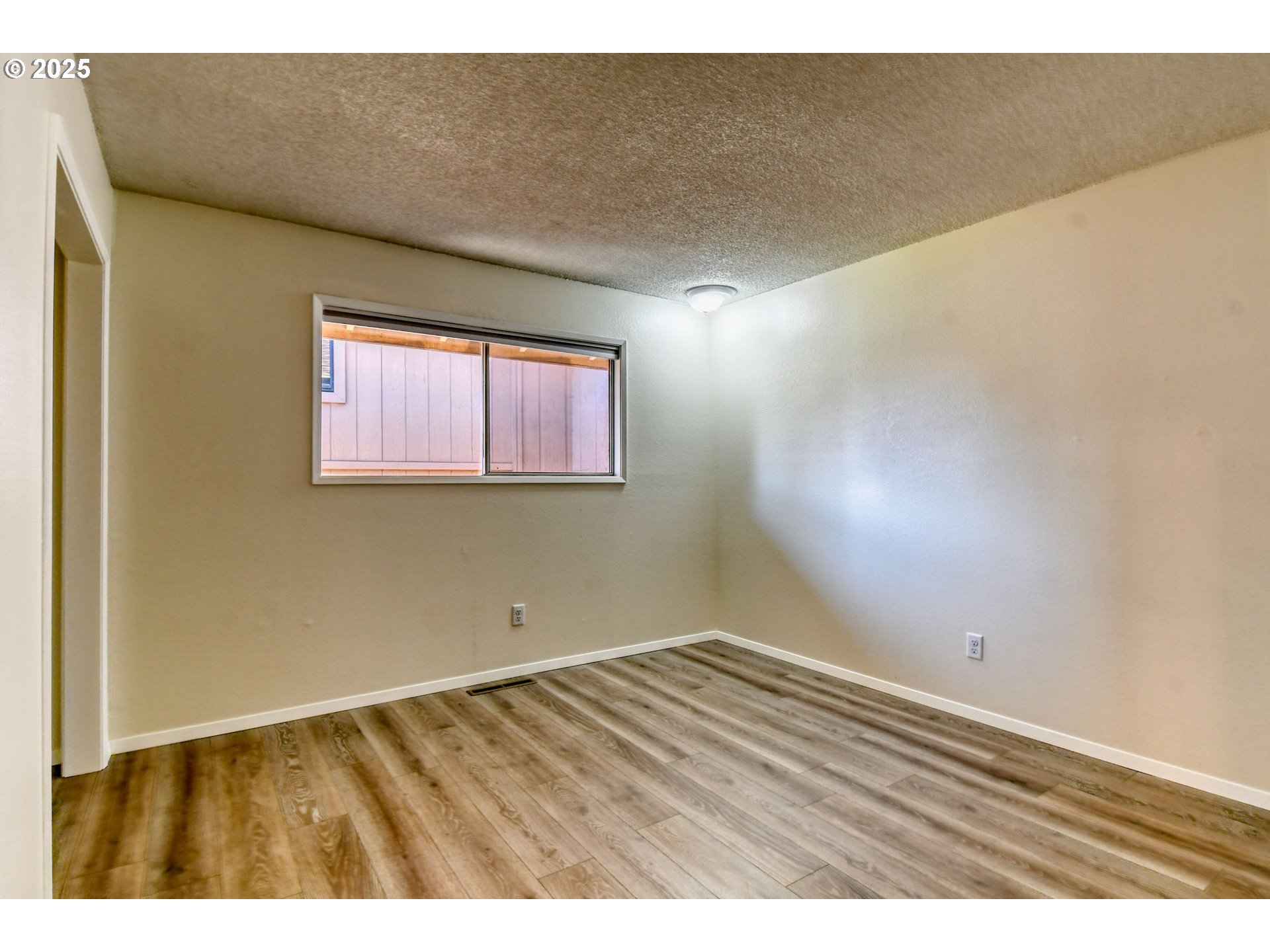 1209 Zeta Court Pendleton, OR 97801 - Photo 40 of 48 an empty room with wooden floor and windows