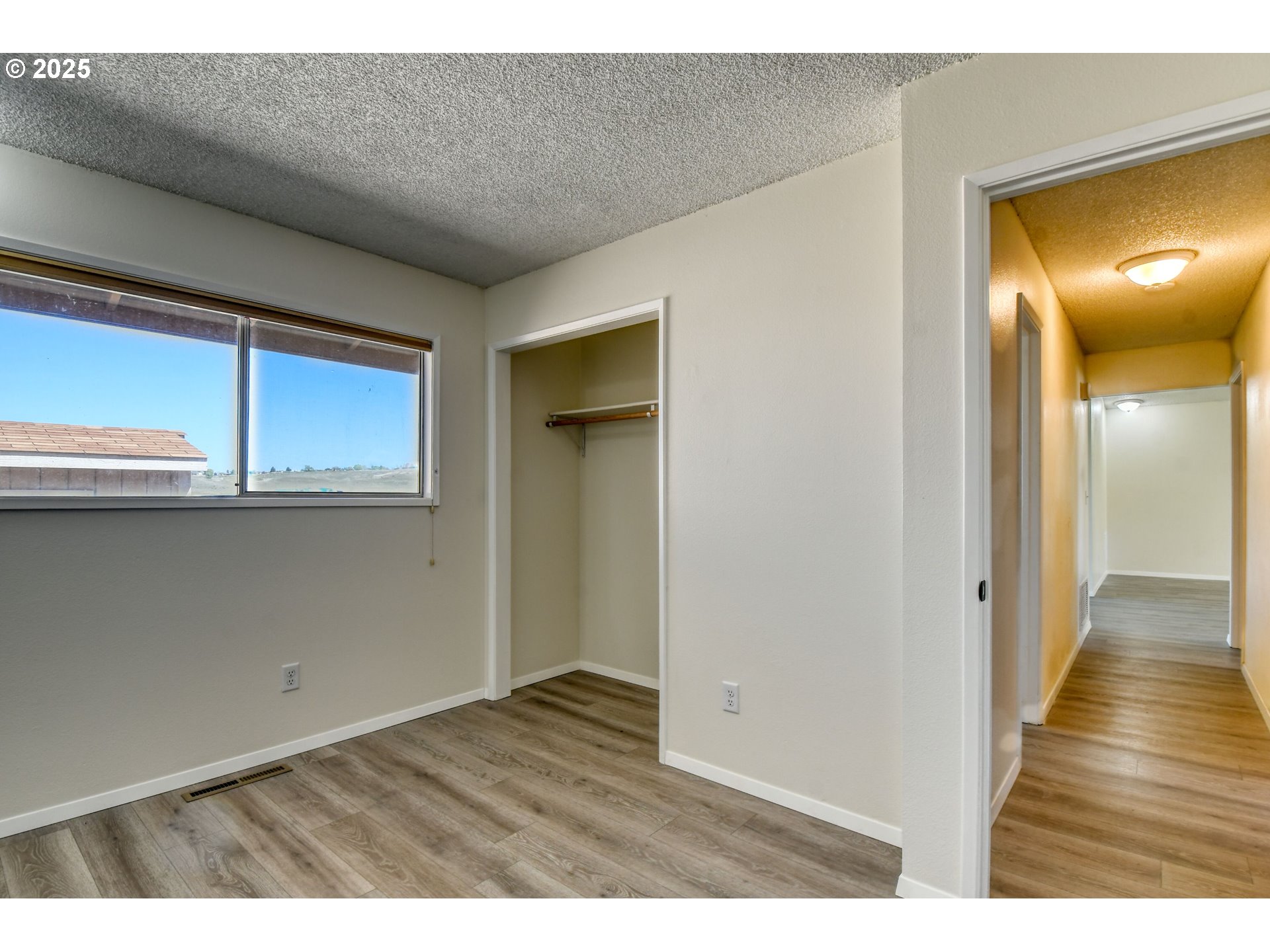 1209 Zeta Court Pendleton, OR 97801 - Photo 42 of 48 a view of an empty room with wooden floor