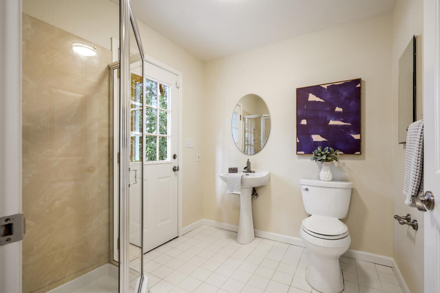 176 Swett Road Woodside, CA 94062 - Photo 20 of 39 a bathroom with a toilet a sink and mirror