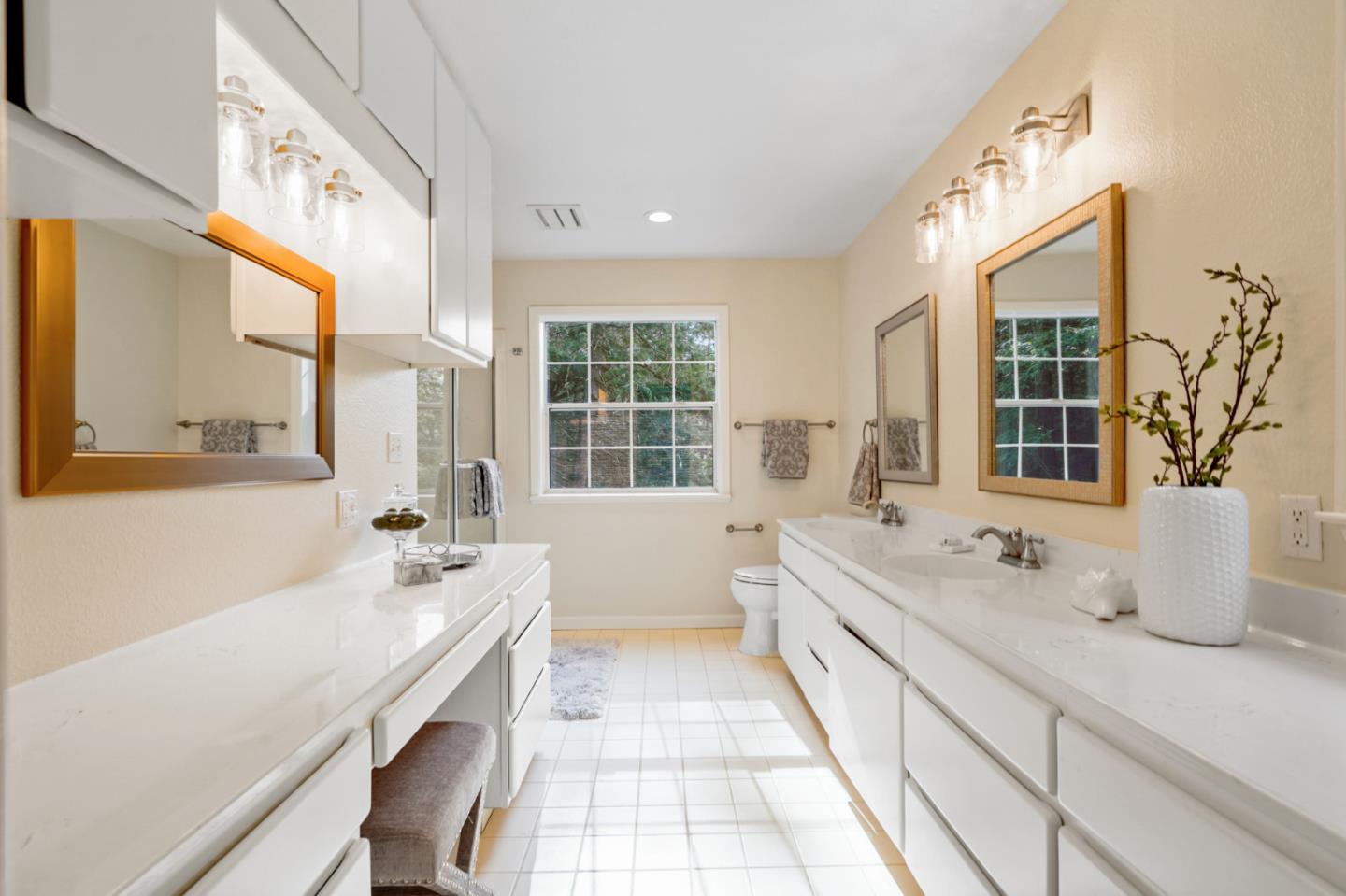 176 Swett Road Woodside, CA 94062 - Photo 23 of 39 a spacious bathroom with a double vanity sink large mirror and a bathtub