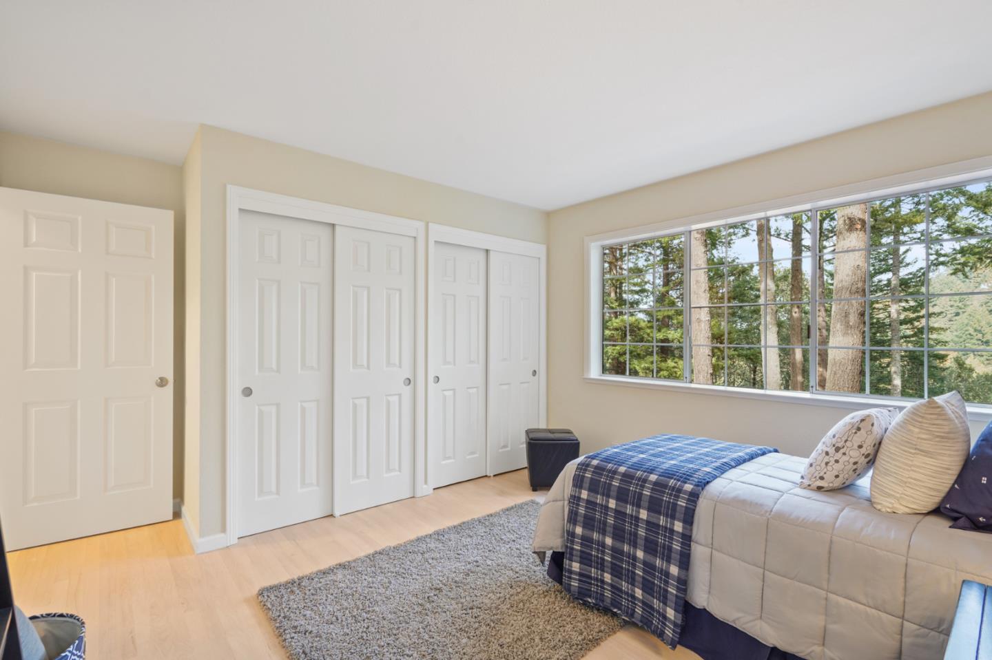 176 Swett Road Woodside, CA 94062 - Photo 27 of 39 a bedroom with a bed and a window