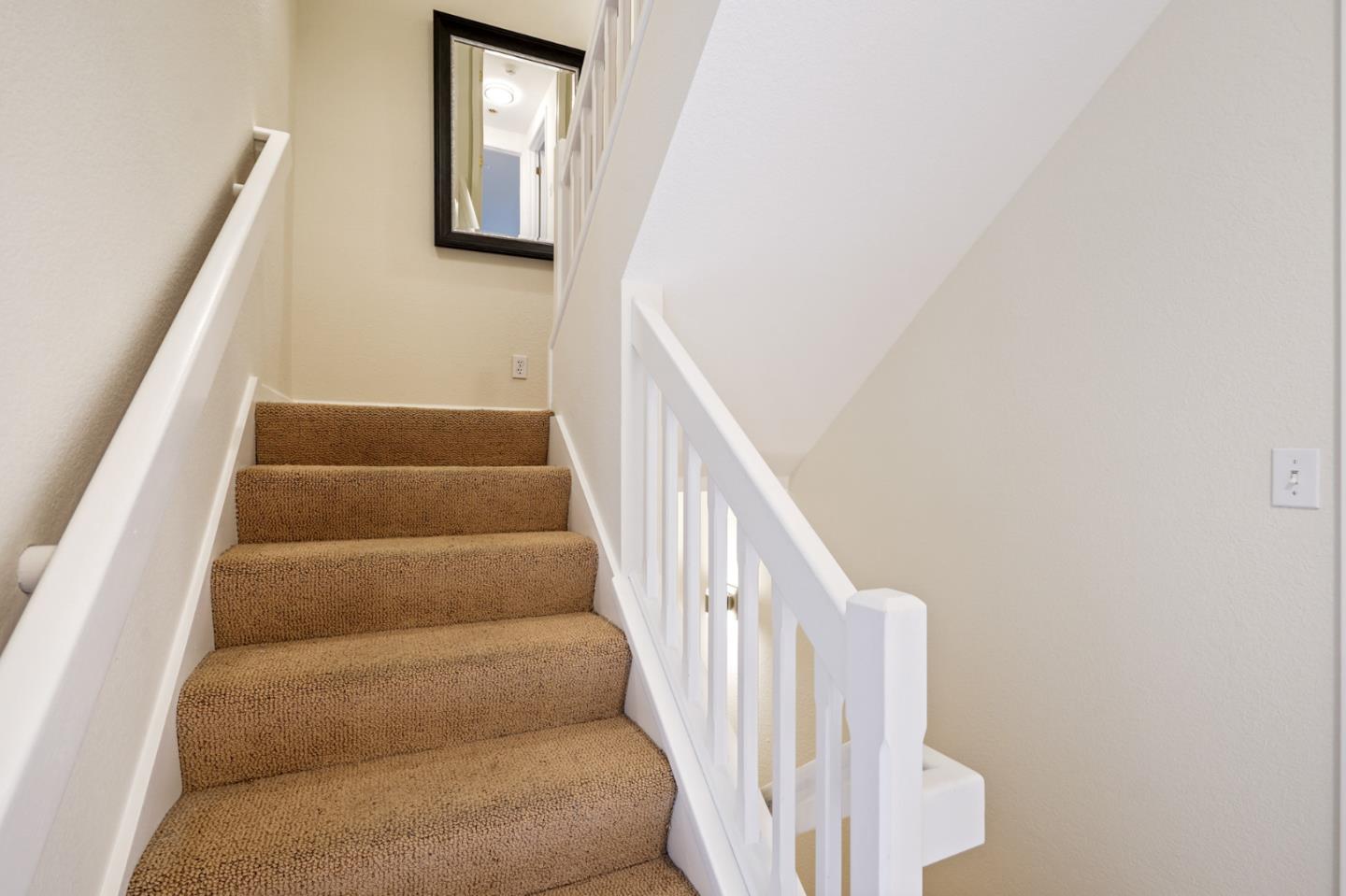 176 Swett Road Woodside, CA 94062 - Photo 30 of 39 a view of staircase with wooden floor and white walls