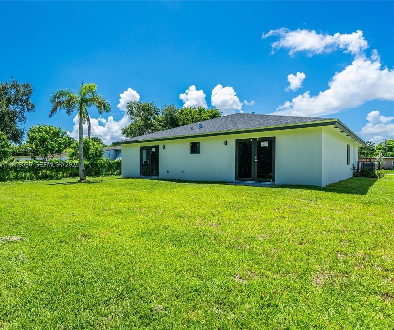 152 Northwest 18th Street Homestead, FL 33030 - Photo 2 of 11 a front view of a house with yard