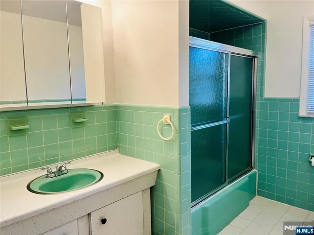 a bathroom with a sink and a shower