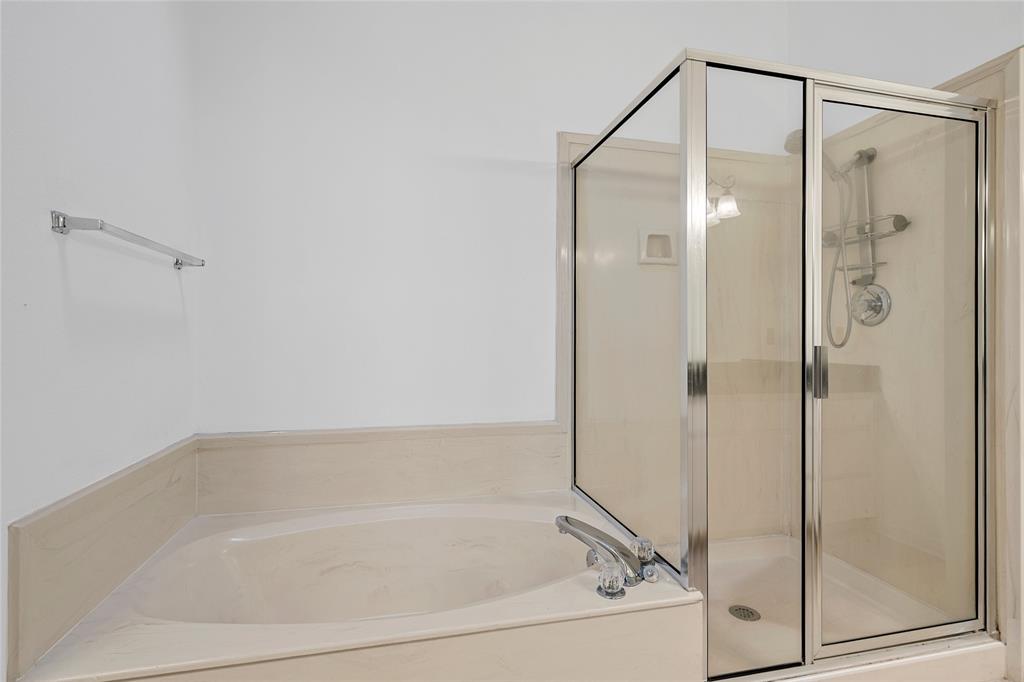 3133 Chimney Hill Drive Waco, TX 76708 - Photo 12 of 29 a bathroom with a bathtub and a shower