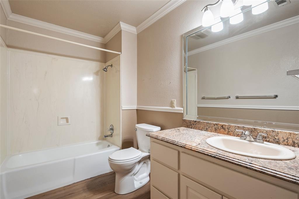 3133 Chimney Hill Drive Waco, TX 76708 - Photo 15 of 29 a bathroom with a granite countertop sink toilet and shower
