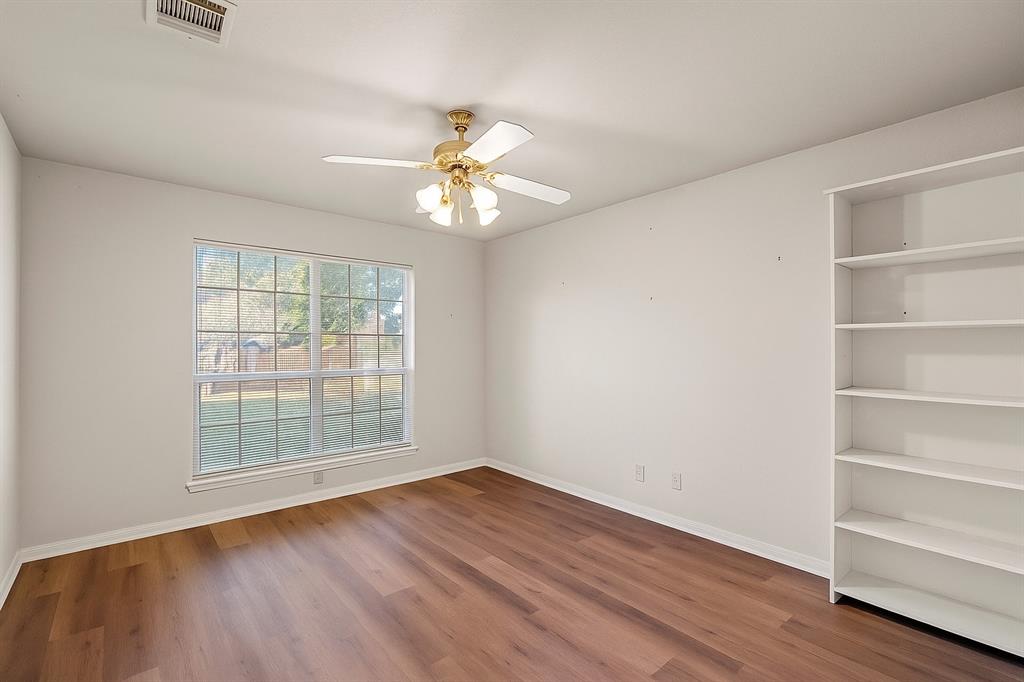 3133 Chimney Hill Drive Waco, TX 76708 - Photo 16 of 29 wooden floor in an empty room with a window