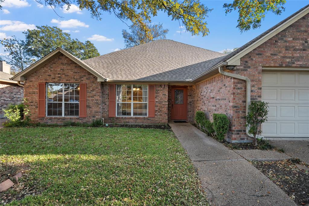 3133 Chimney Hill Drive Waco, TX 76708 - Photo 2 of 29 a front view of a house with a garden