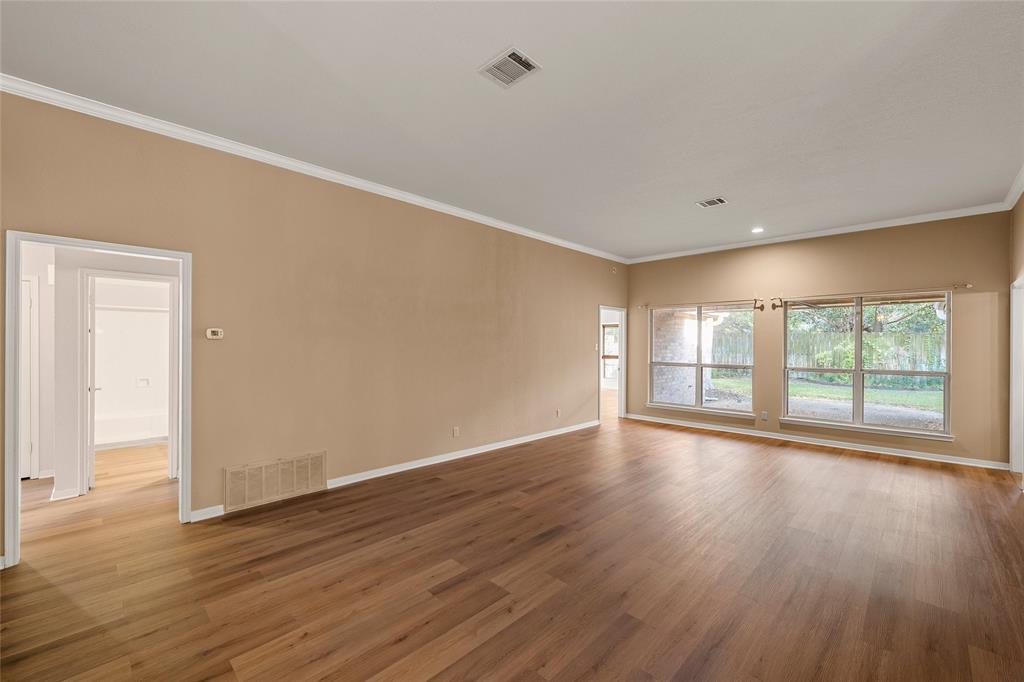 3133 Chimney Hill Drive Waco, TX 76708 - Photo 6 of 29 a view of an empty room with wooden floor and a window