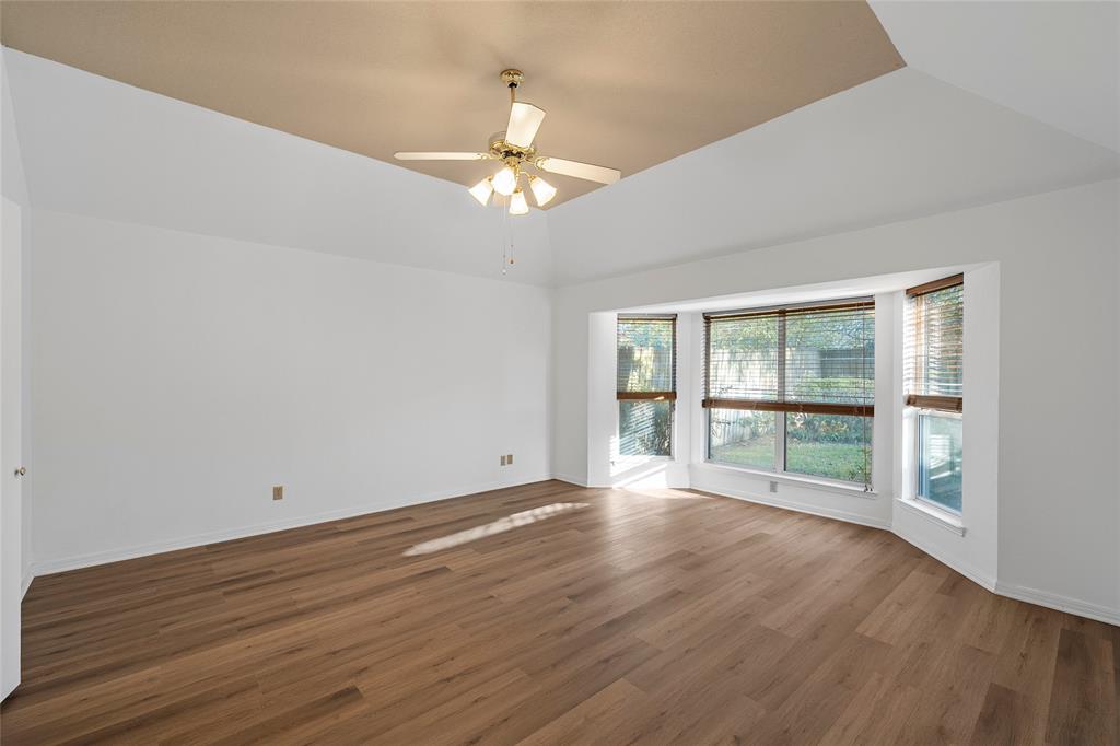 3133 Chimney Hill Drive Waco, TX 76708 - Photo 9 of 29 a view of an empty room with wooden floor and a window