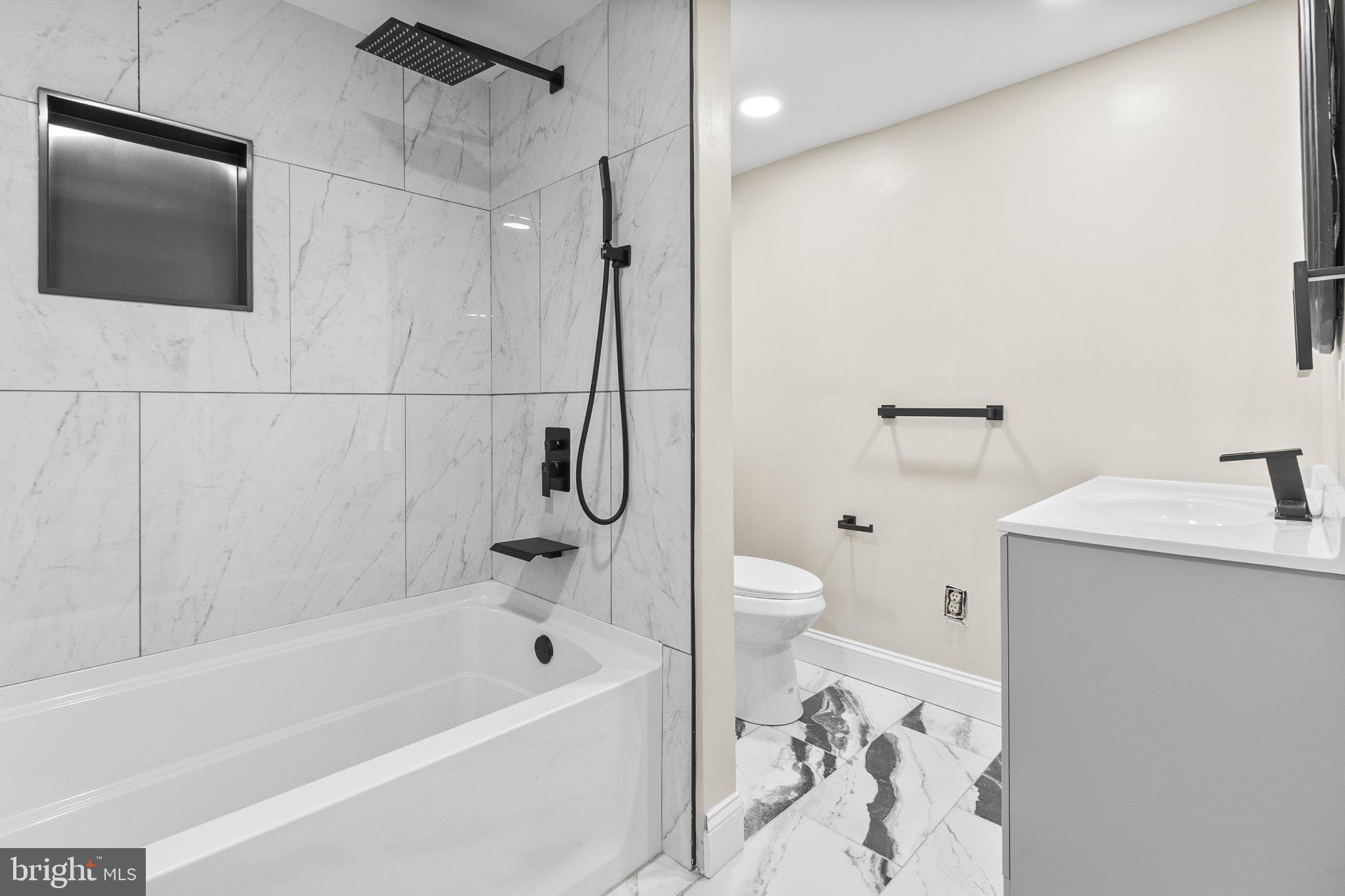 781 South Halsey Road Dover, DE 19901 - Photo 20 of 23 Sleek modern bathroom with marble accents.