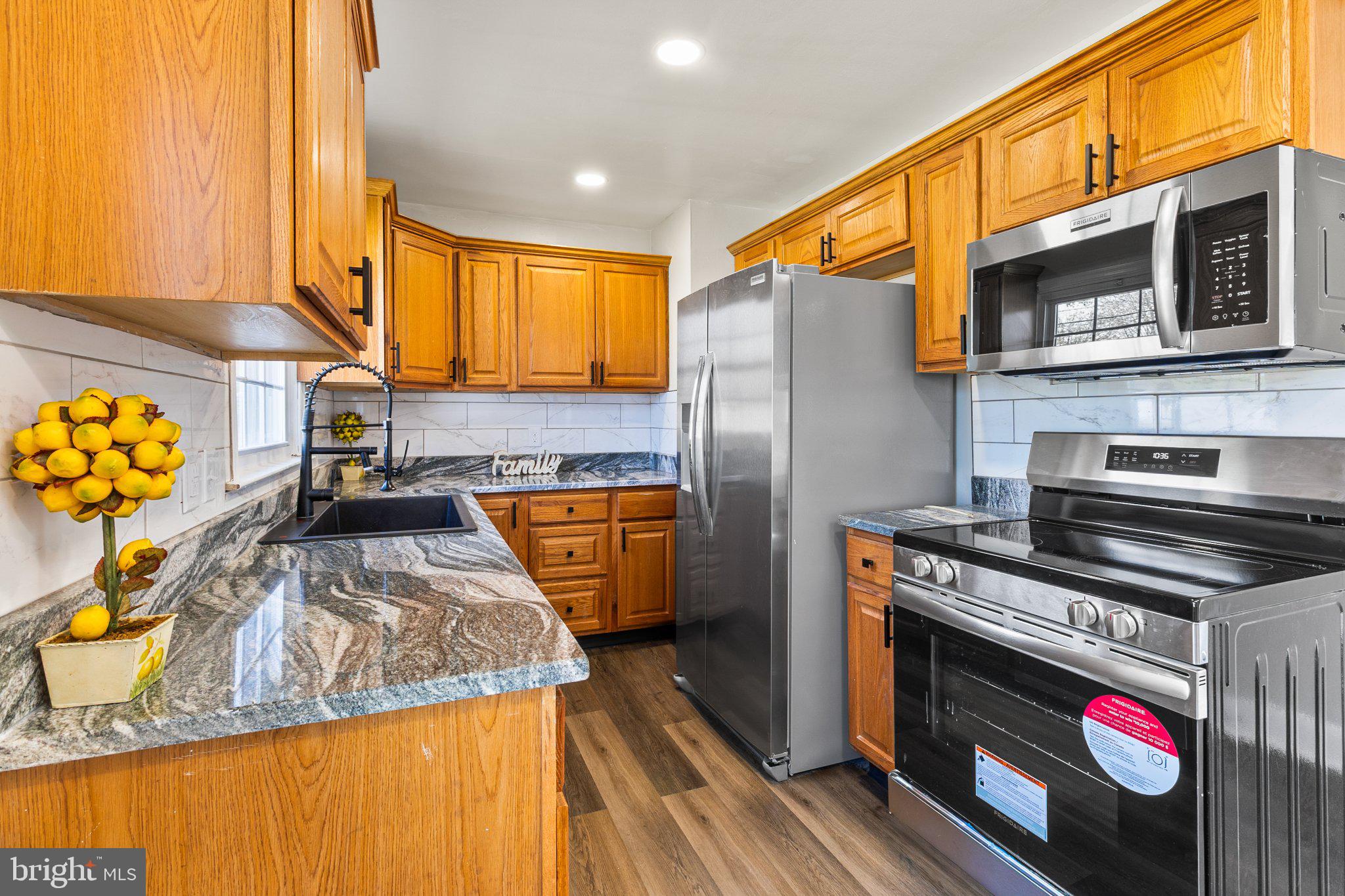 781 South Halsey Road Dover, DE 19901 - Photo 7 of 23 Modern kitchen with warm wood tones.