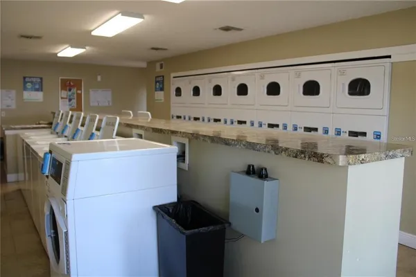 a room with gym equipment and a large window