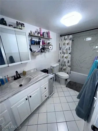 a kitchen with sink cabinets and appliances