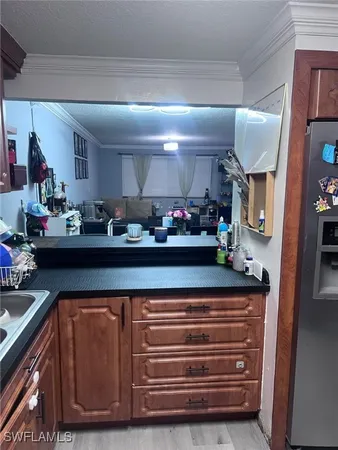 a kitchen with stainless steel appliances granite countertop a sink and cabinets