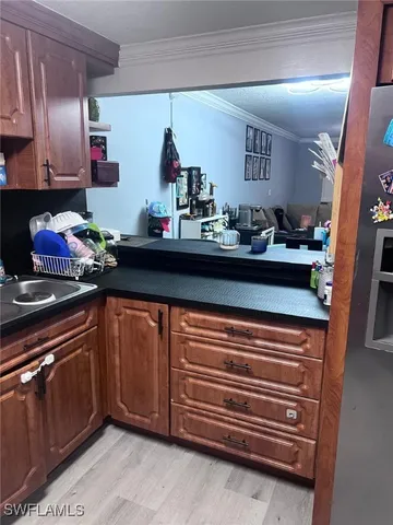 a kitchen with stainless steel appliances granite countertop a sink and cabinets