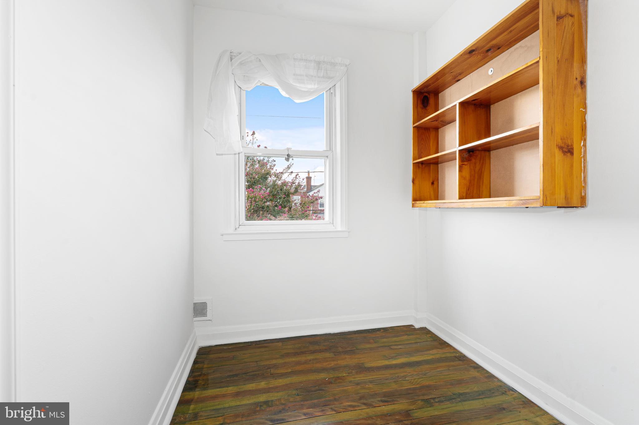 3454 McShane Way Baltimore, MD 21222 - Photo 13 of 35 a view of empty room with wooden floor